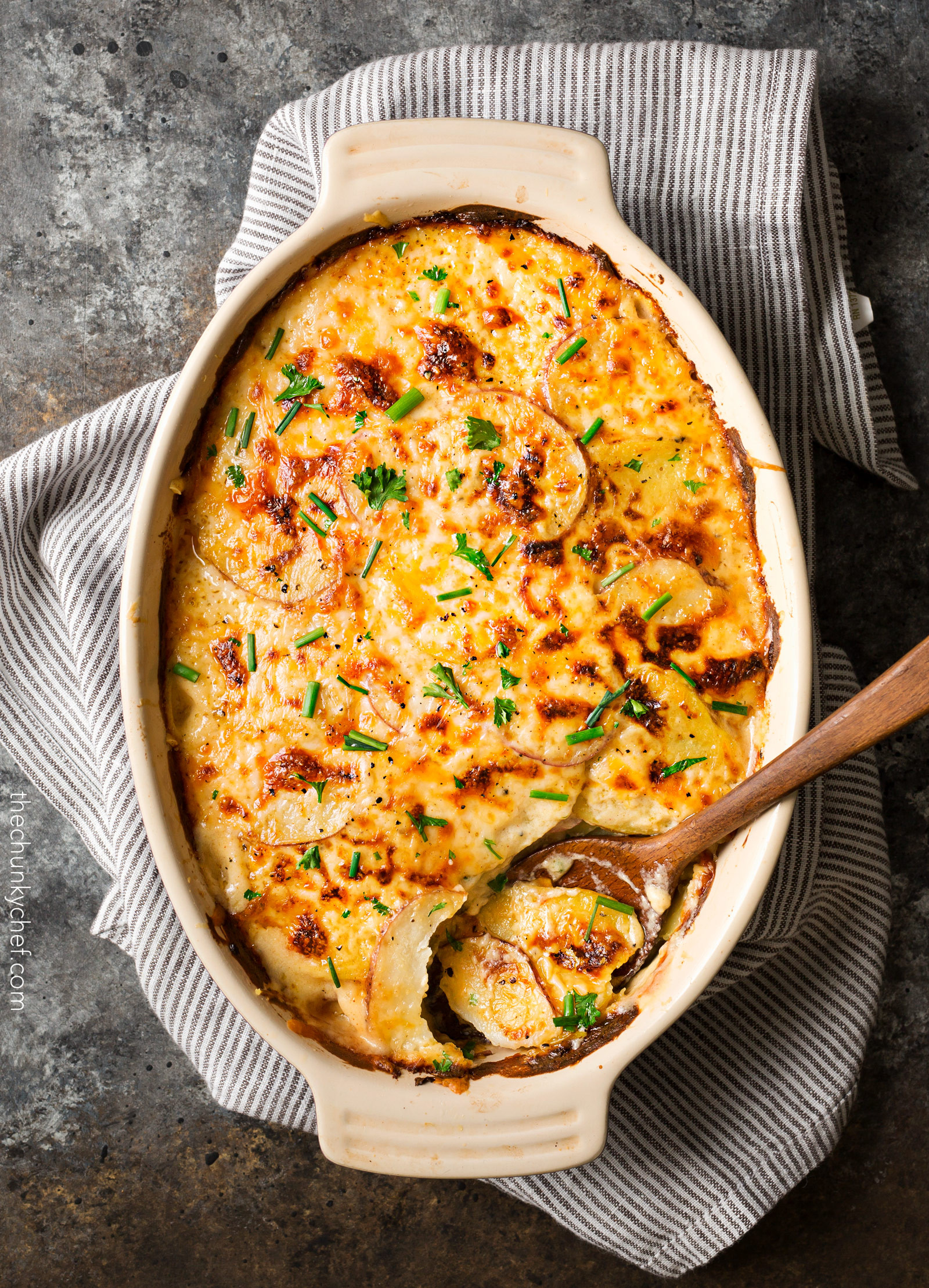 Cheesy Scalloped Potatoes Recipe
 Garlic Parmesan Cheesy Scalloped Potatoes The Chunky Chef