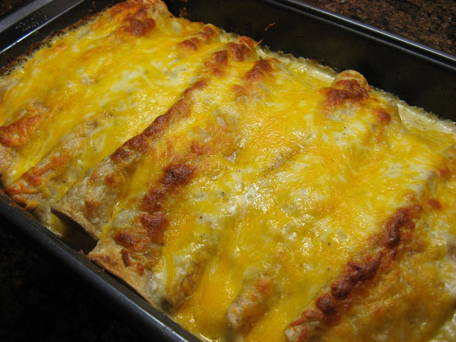 Green Chicken Enchiladas
 The Well Fed Newlyweds Creamy Green Chile Chicken Enchiladas