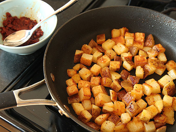 Making Breakfast Potatoes
 Breakfast Tacos with Crispy Potatoes Chorizo and Fried