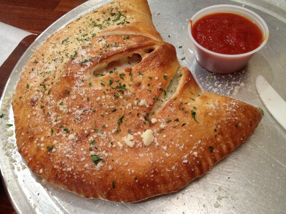 Tomato Pie Pizza Joint
 Calzone U can choose 3 topping in it twice as big as my