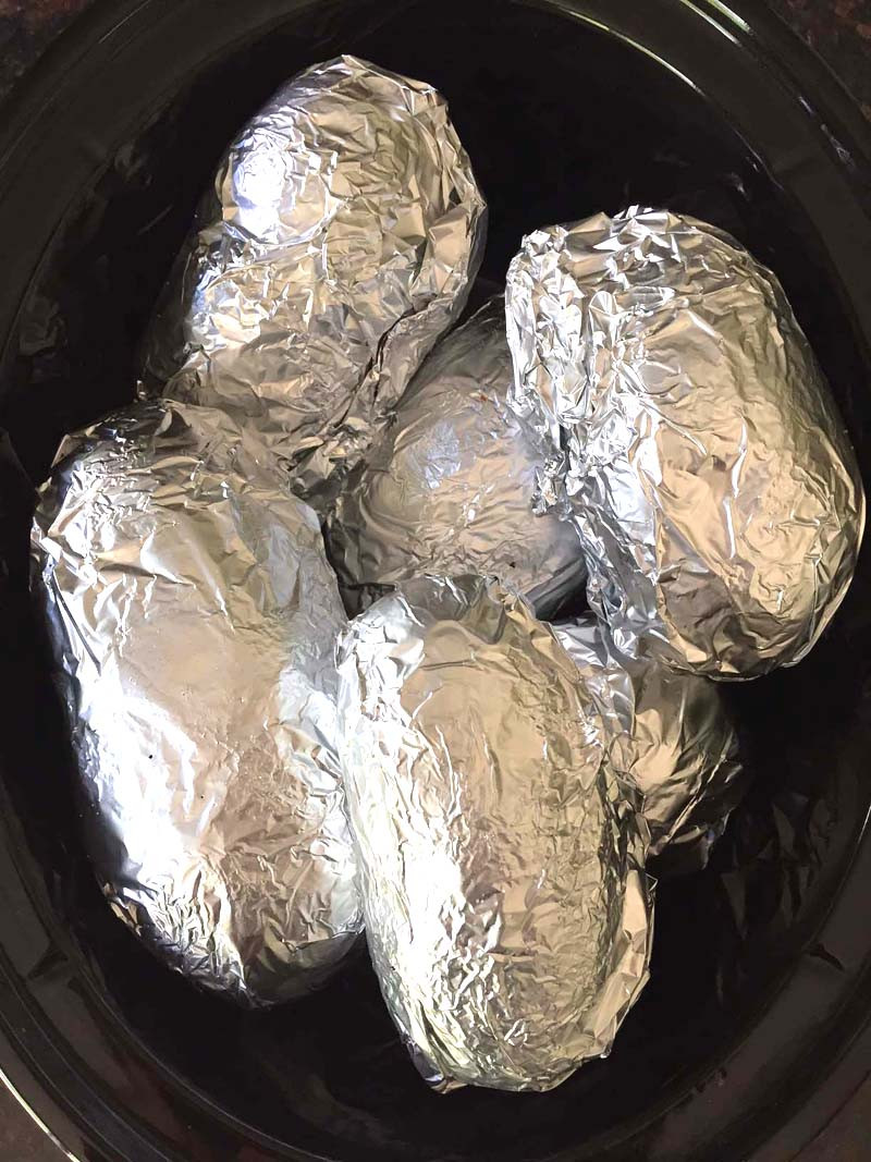 Baked Potato In Oven Wrapped In Foil
 Crockpot Baked Potatoes Recipe – Easy Slow Cooker Potatoes