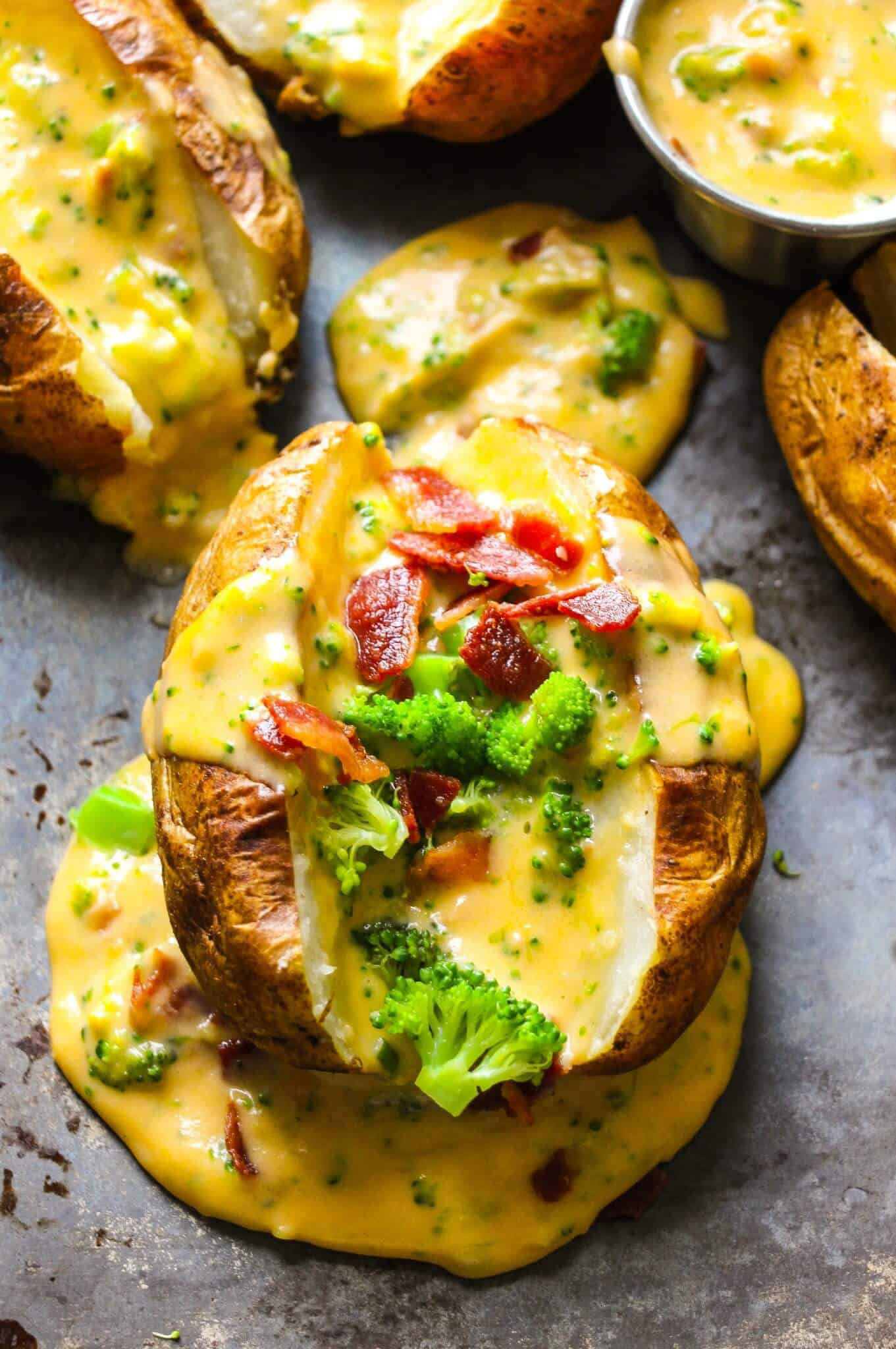 Baked Potato With Cheese
 Baked Potatoes with Loaded Broccoli Bacon Cheese Sauce