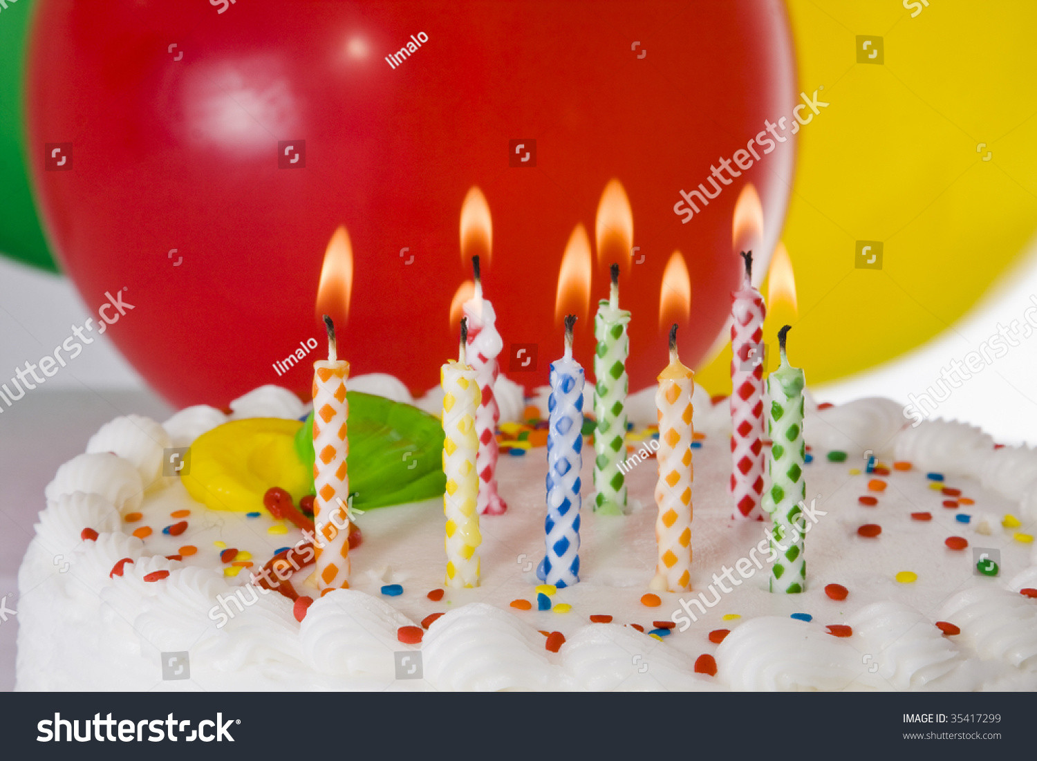 Birthday Cake With Candles And Balloons
 Birthday Cake With Lighted Candles And Balloons Stock
