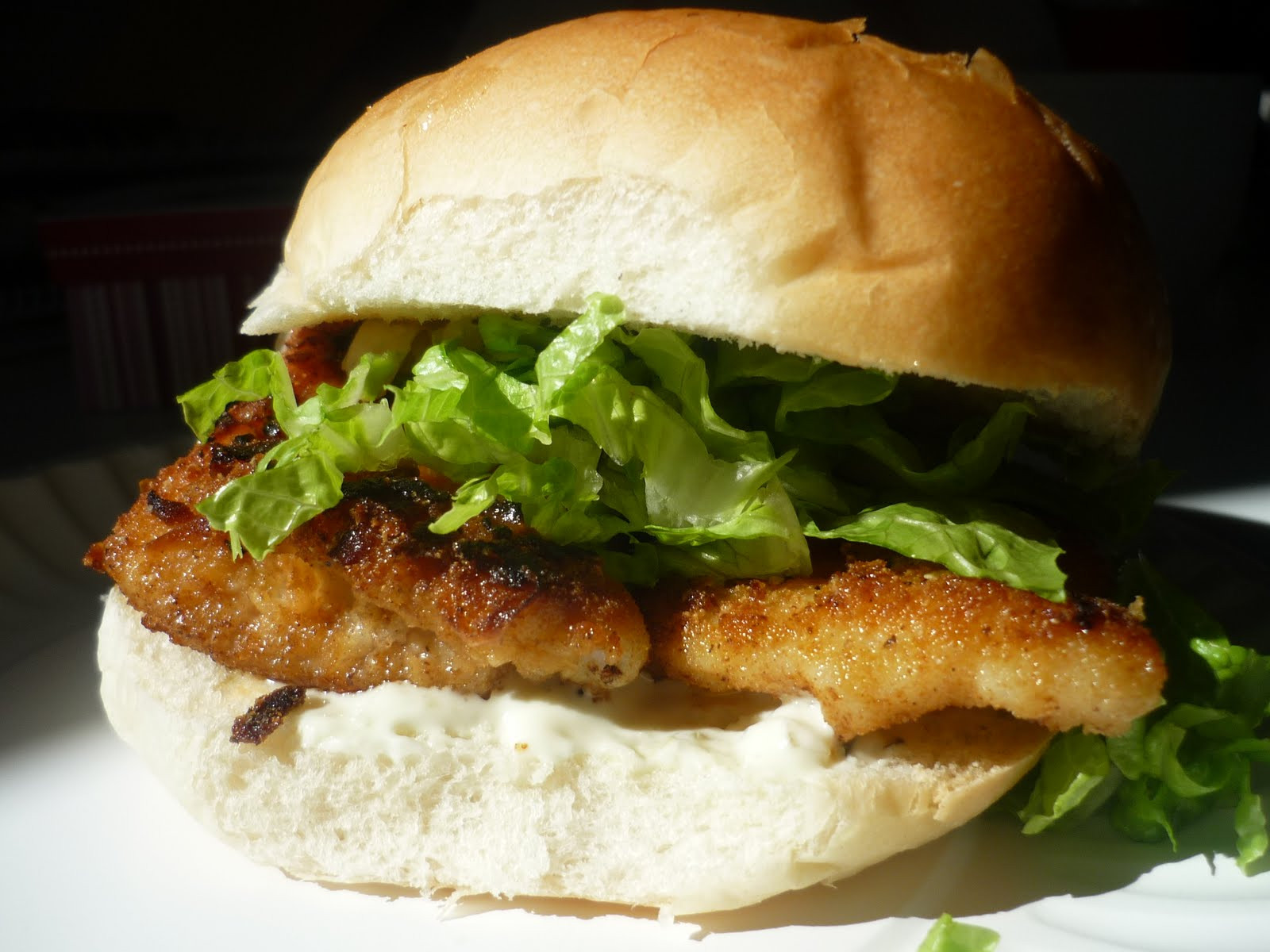 Breaded Pork Tenderloin
 Breaded Pork Tenderloin Sandwich on Toasted Egg Bun Lemon