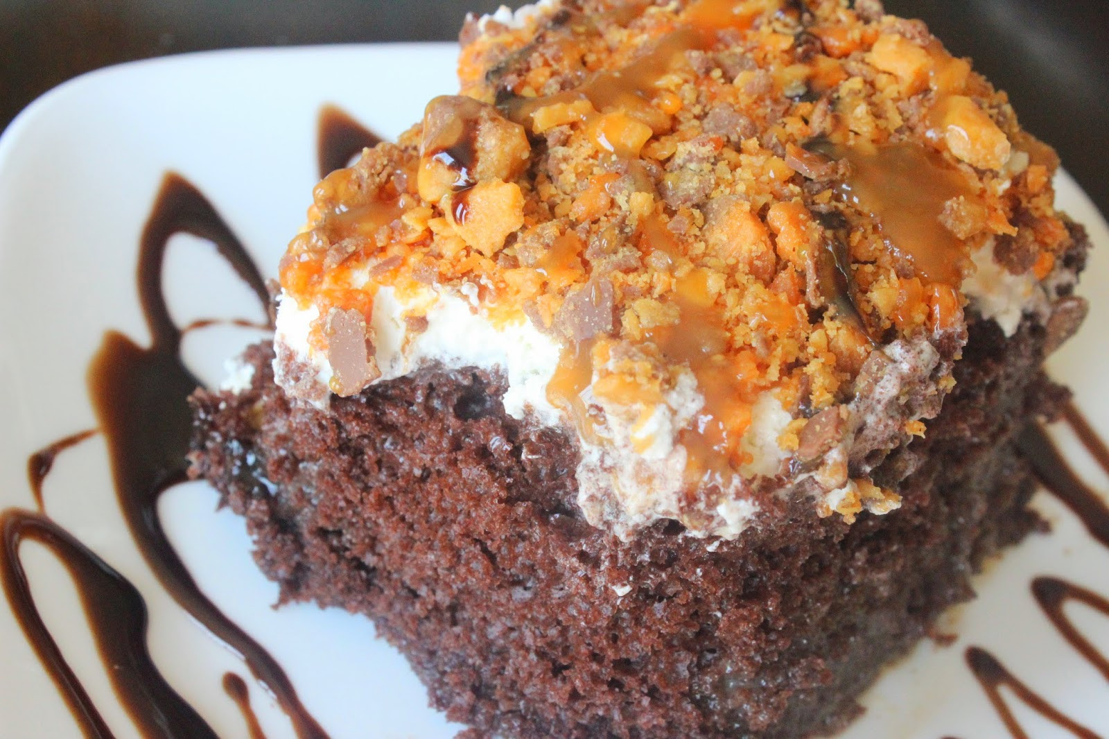 Butterfinger Poke Cake
 Cupcakes and Pearls Butterfinger Poke Cake