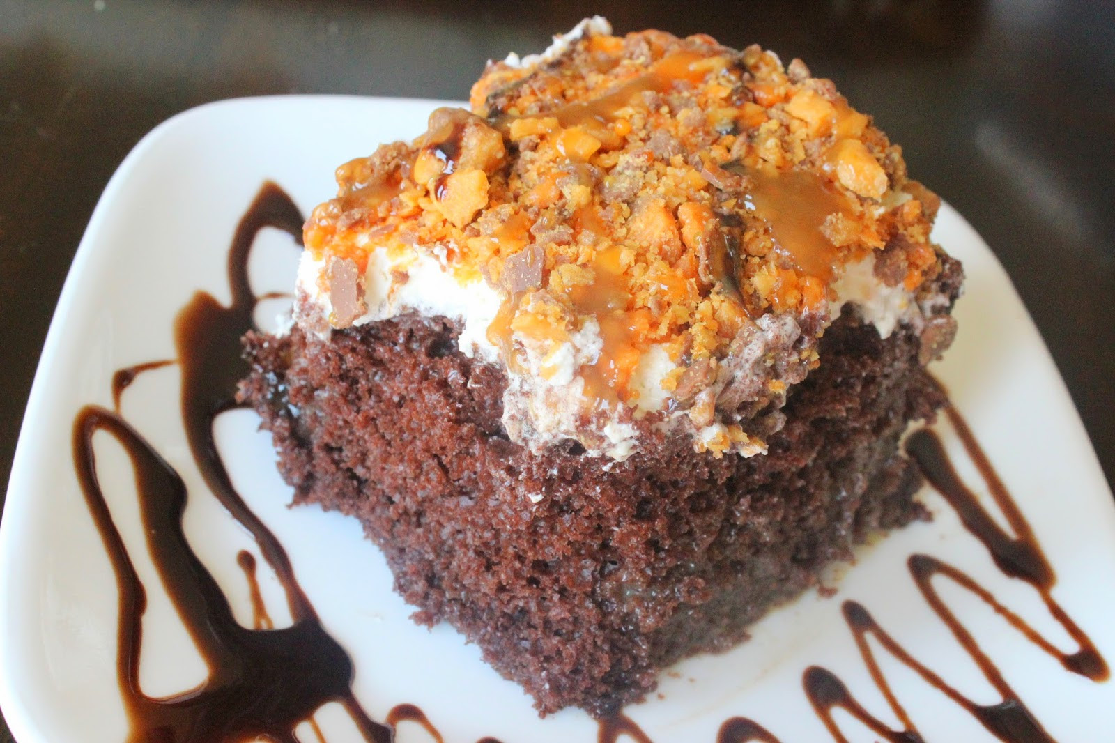 Butterfinger Poke Cake
 Cupcakes and Pearls Butterfinger Poke Cake