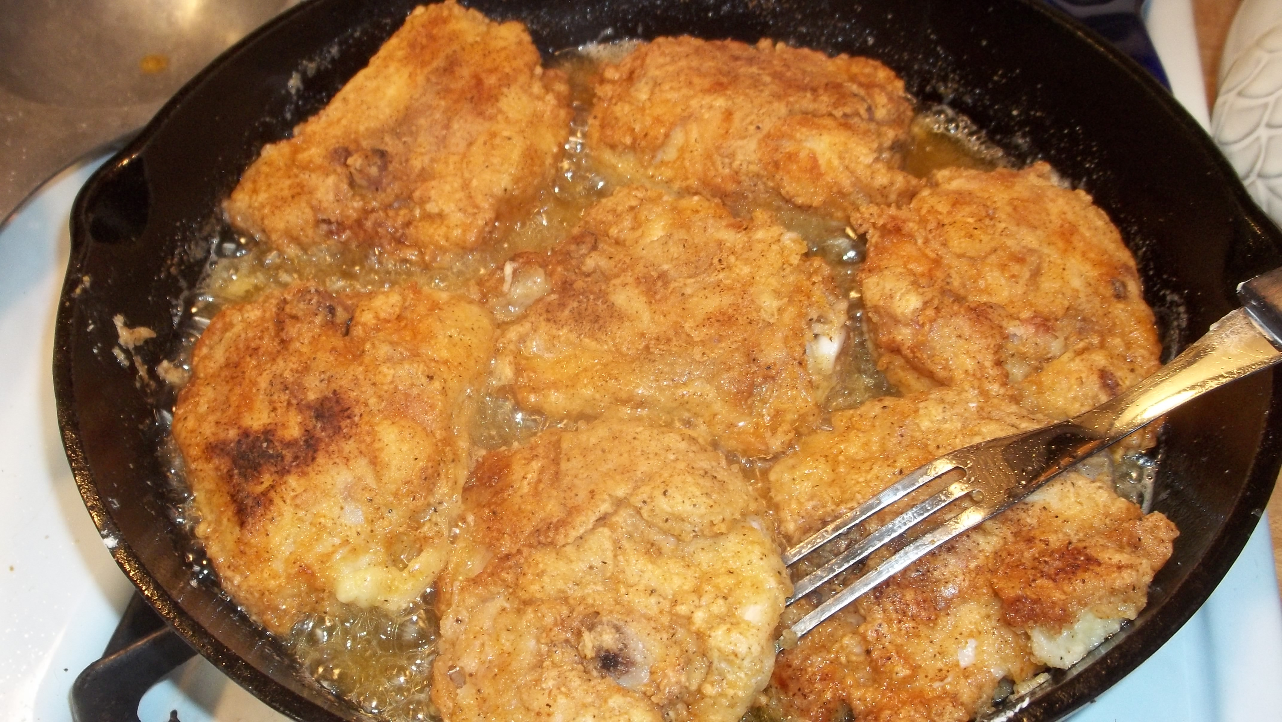 Frying Chicken Thighs
 skillet fried chicken thighs