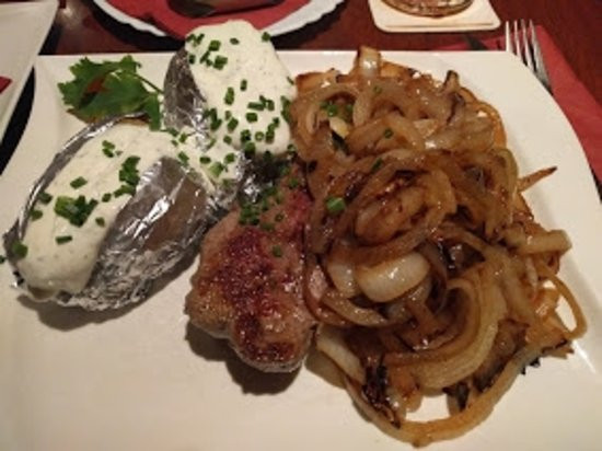 Great Steak And Potato
 Great steak smothered with a mess of roasted onions Nice