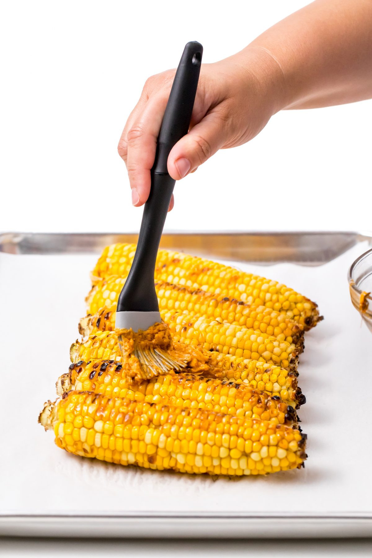 Grilled Sweet Corn
 Grilled sweet corn with chili lime honey butter