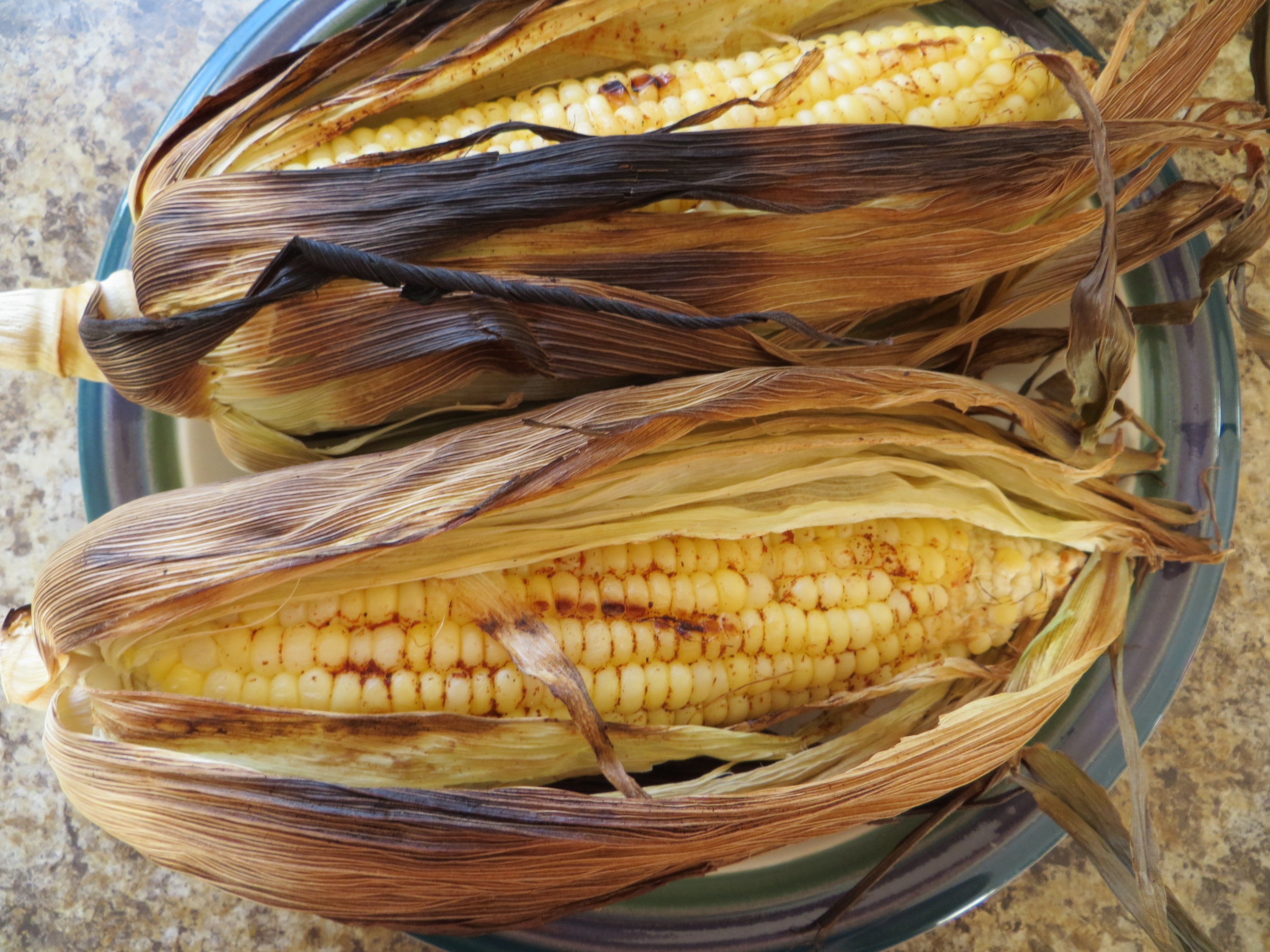 Grilling Corn In The Husk
 grilled corn