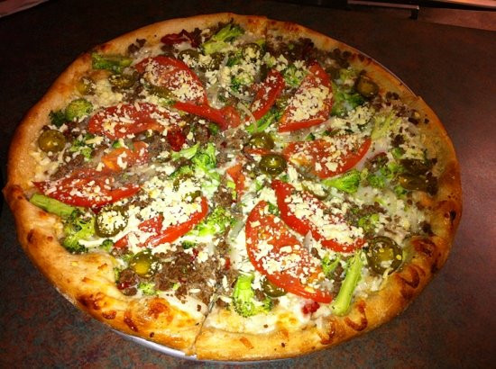 Ground Beef Pizza
 white pizza with ground beef broccoli tomato and