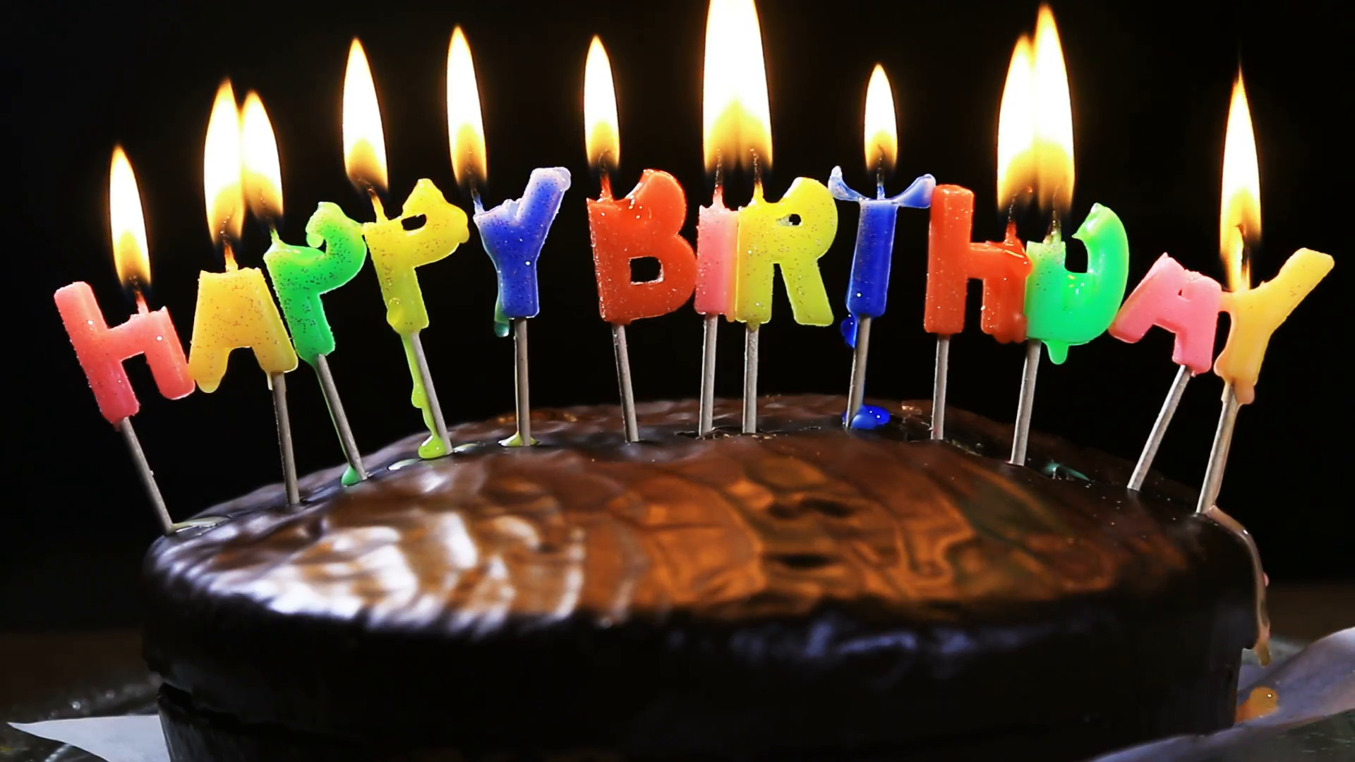 Happy Birthday Cake With Candles
 lighted candles on a happy birthday cake candles with the