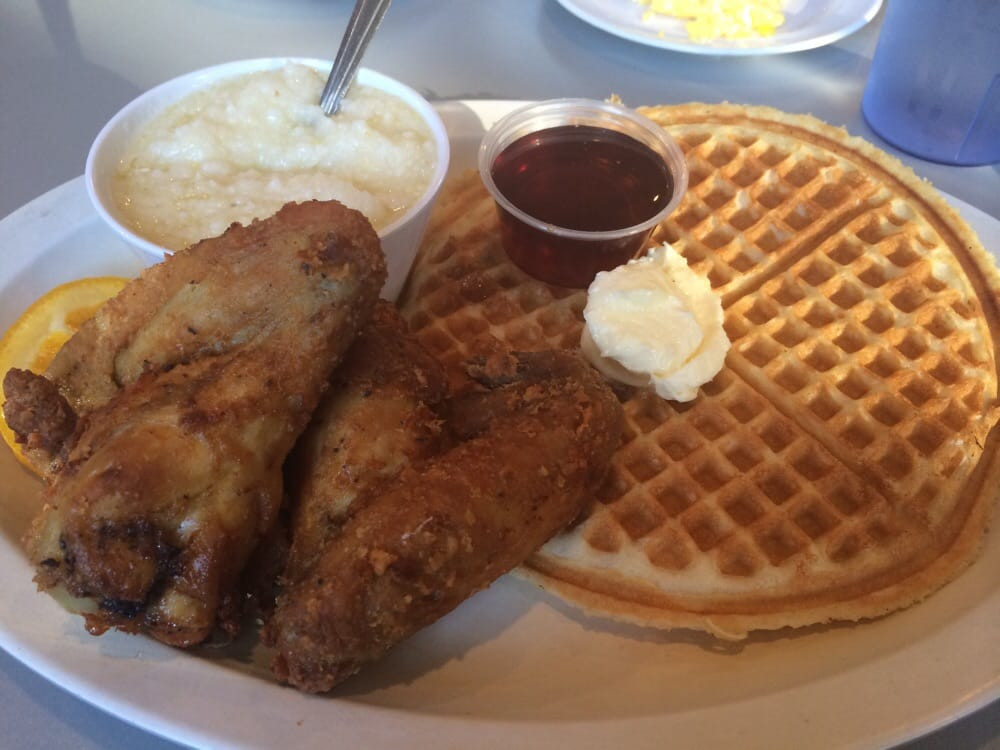 Home Of Chicken And Waffles
 Grits 2 chicken wings & a waffle $12 Yelp