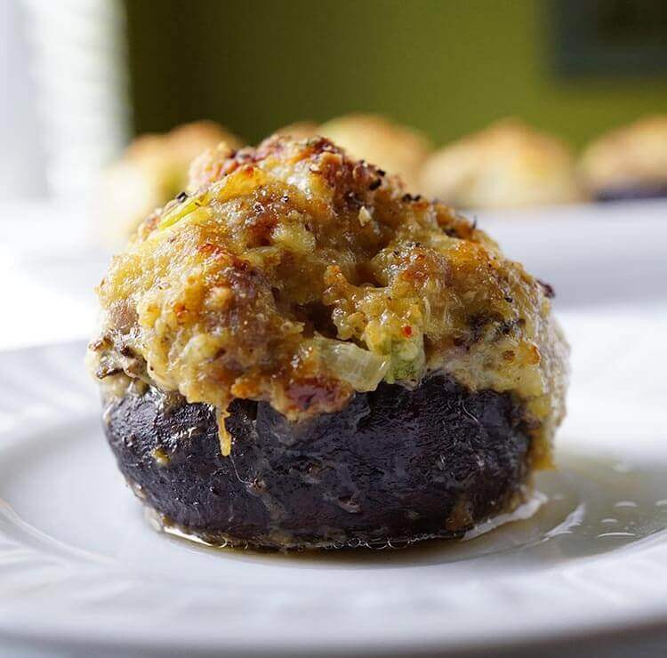 How Long To Cook Stuffed Mushrooms
 Baked stuffed mushrooms on a white plate The top of the