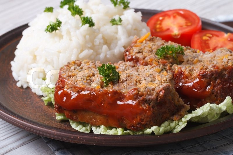 Meatloaf With Rice
 Delicious meatloaf with rice and tomatoes on a plate close