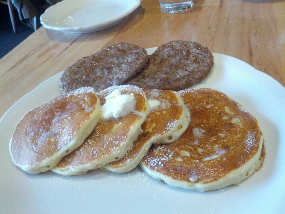 Pancakes And Sausage
 Short stack of banana pancakes and and order of special