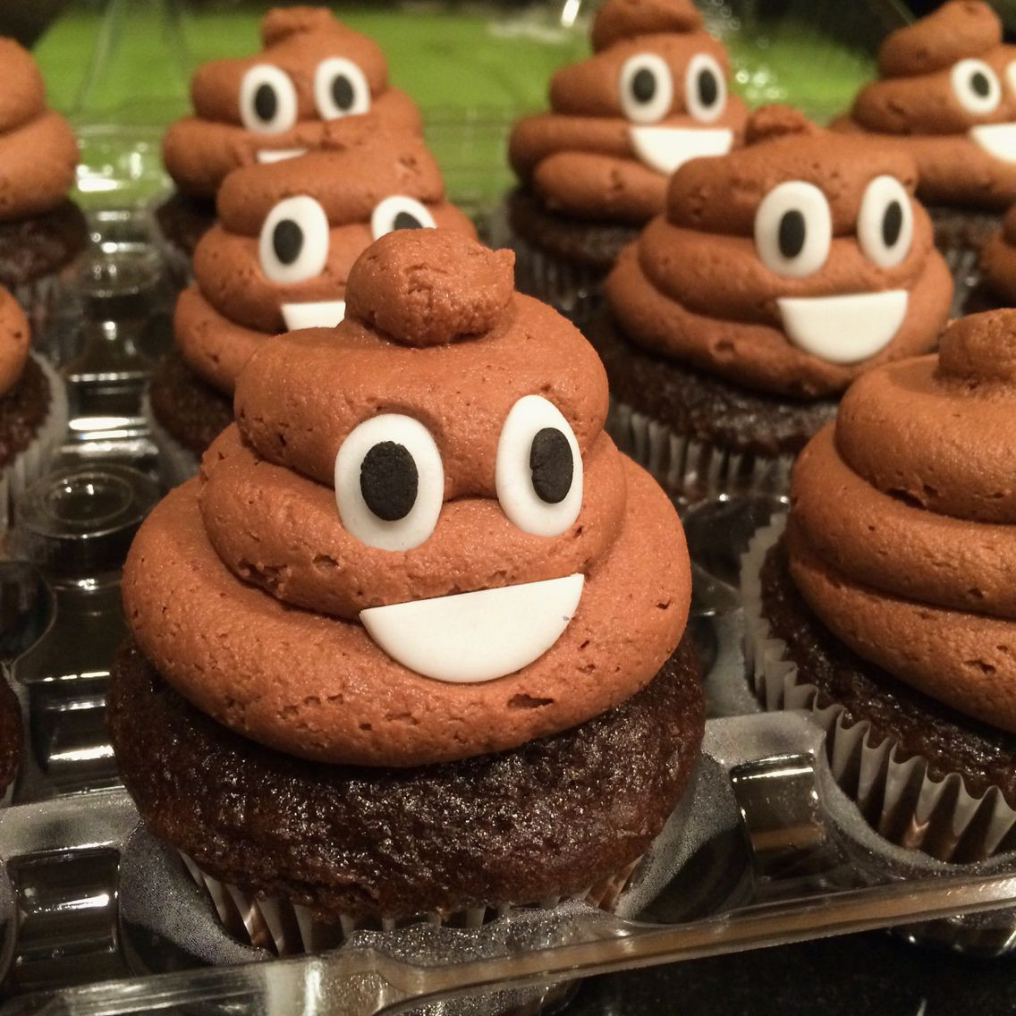 Poop Emoji Cupcakes
 Poop emoji cupcakes Fondant eyes and mouth Used a large