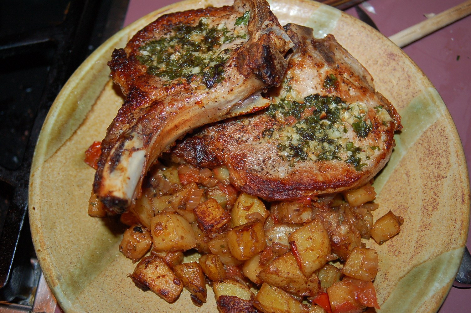 Pork Chops And Potatoes
 Pork Chops with Garlic & Parsley Butter served with Savory