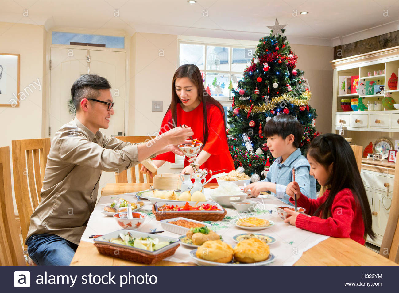 Traditional New Year'S Dinner
 Chinese family enjoying their christmas dinner They are