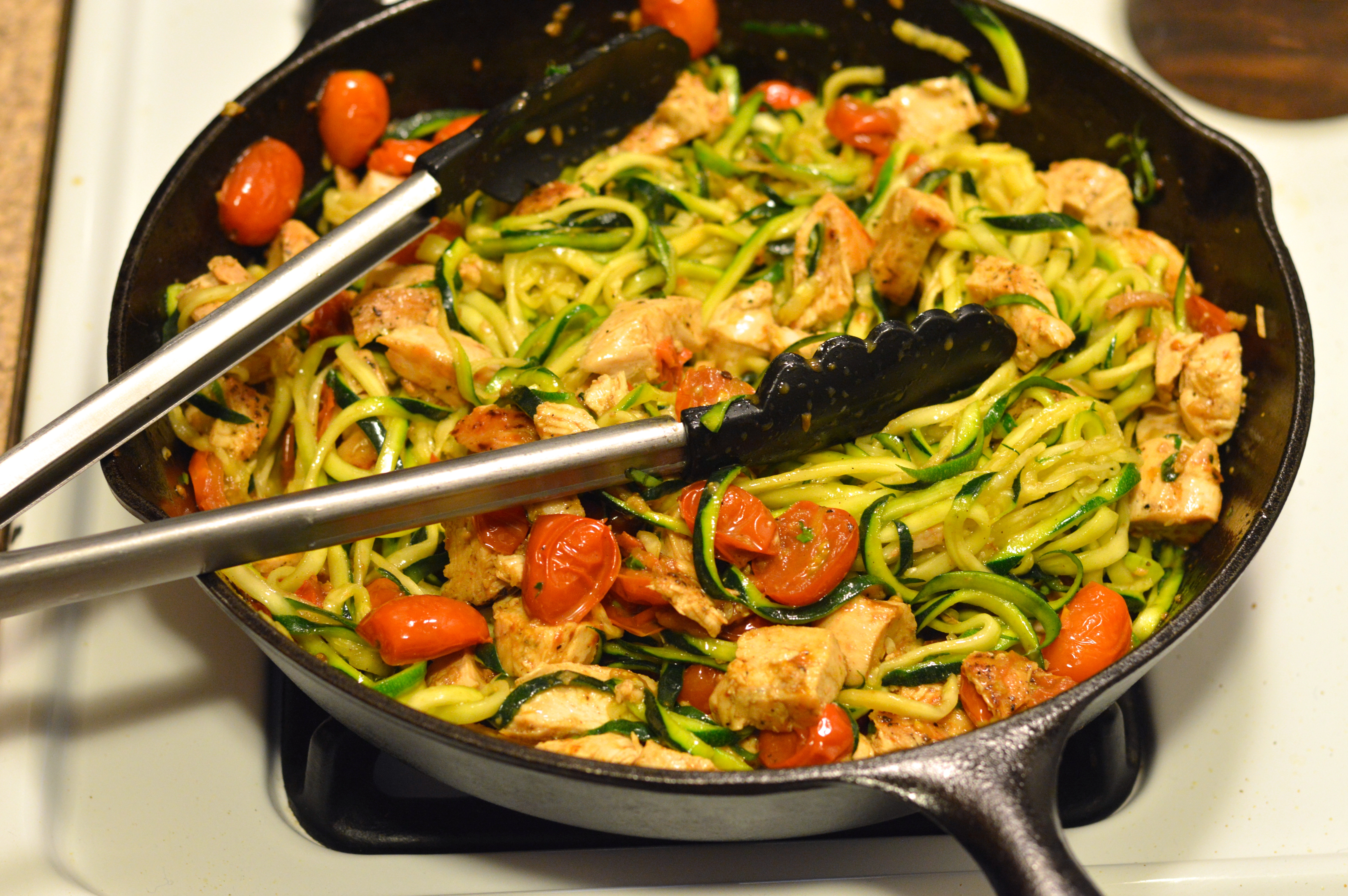 Zucchini And Chicken
 zucchini “pasta” with chicken white wine & tomatoes