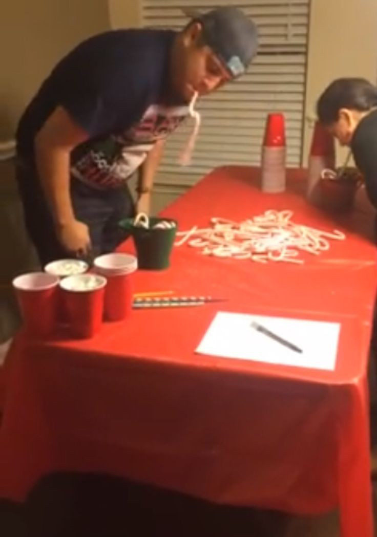 Christmas Minute To Win It Games Candy Cane
 Bobbing for Candy Canes Christmas Party Game Idea