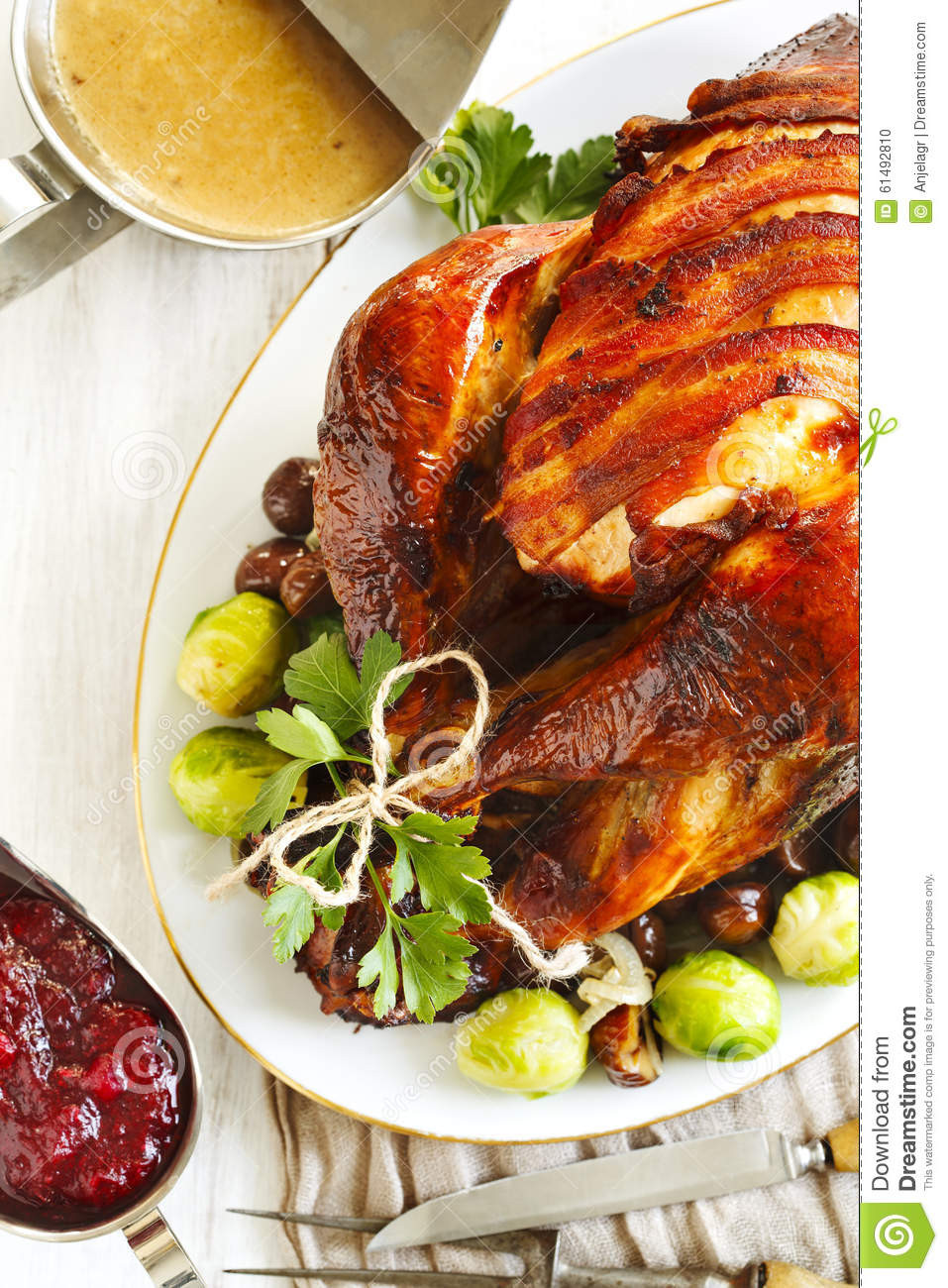 Prepared Christmas Dinners To Go
 Roasted Turkey With Bacon And Garnished With Chestnuts And